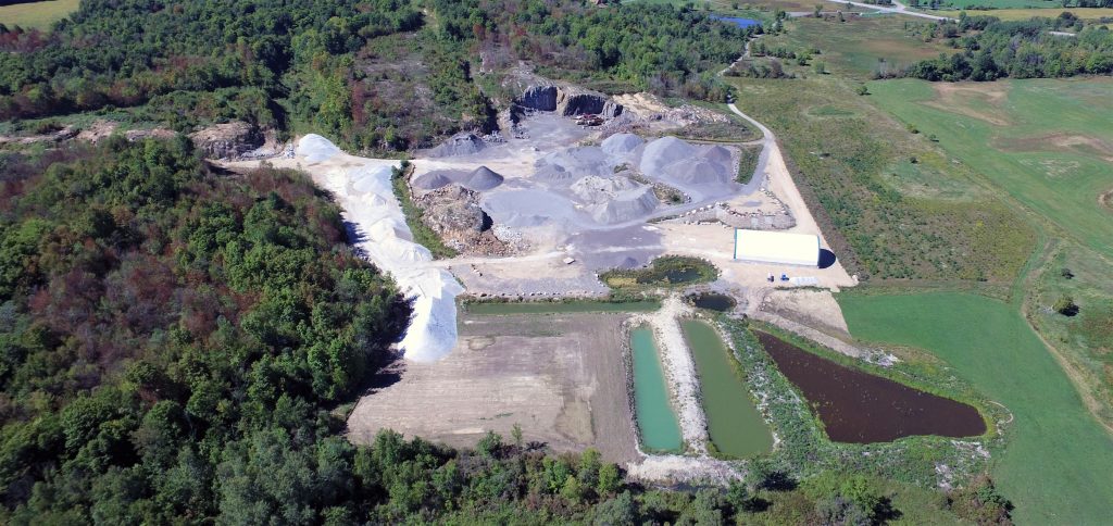 An aerial view of a large gravel pit.